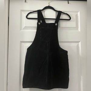 Black Overall Mini Dress with two buttons for adjusting